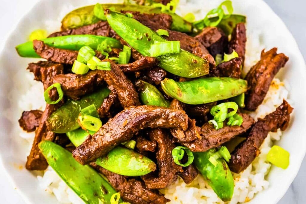 A close up shot of orange beef.