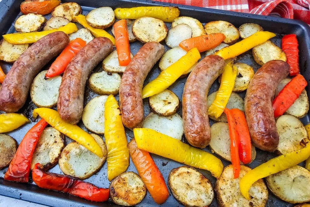 A close up shot of sheet pan sausage peppers and potatoes.