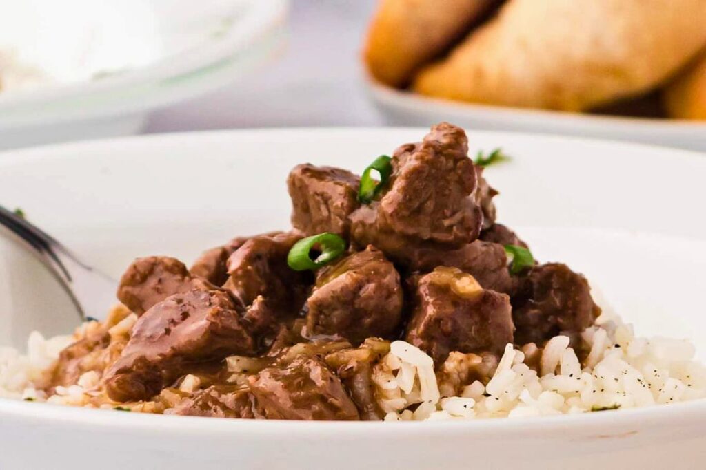 A close up shot of steak rice bowl.