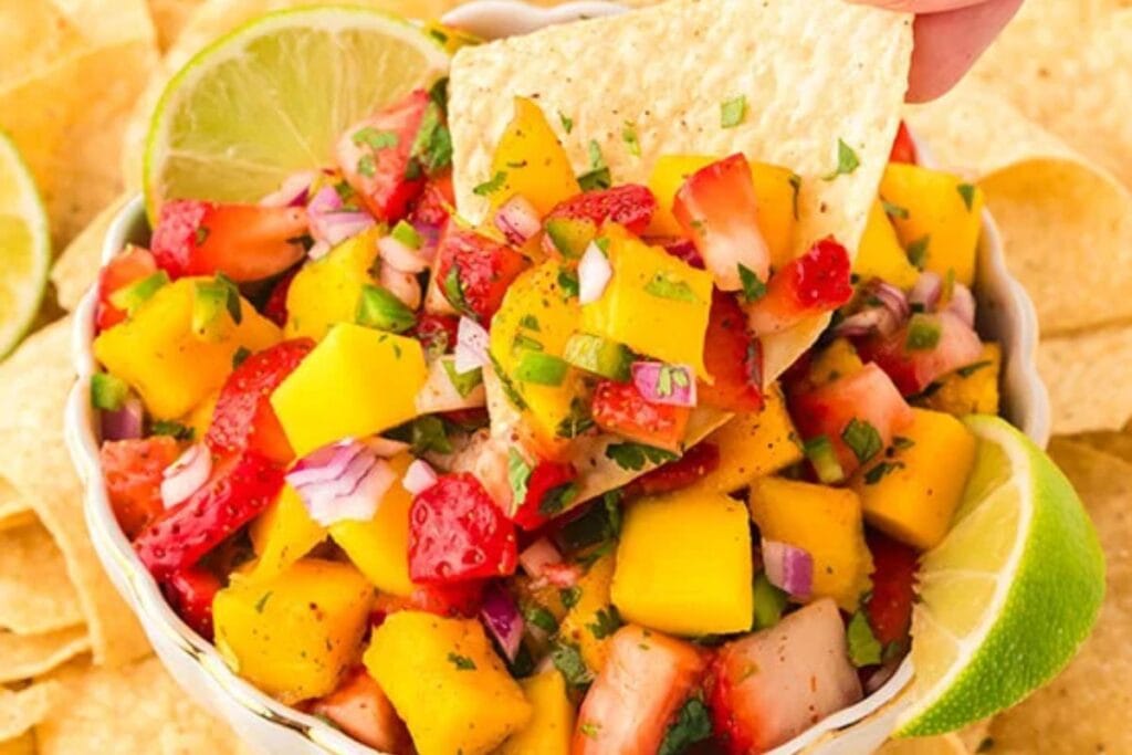 A close up shot of strawberry mango salsa.