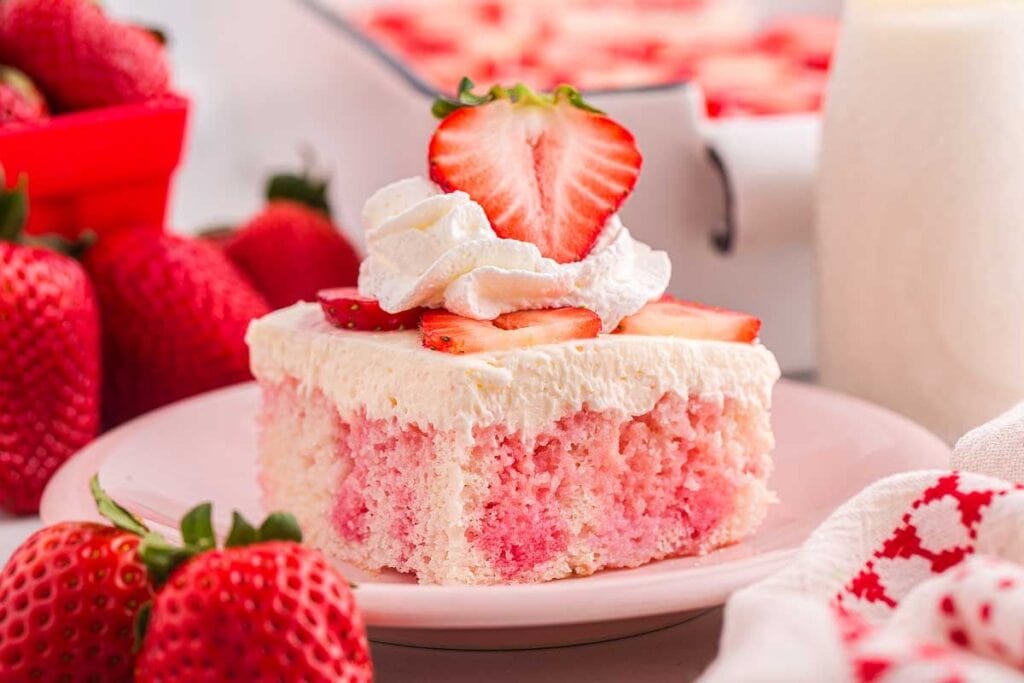 A close up shot of strawberry poke cake.