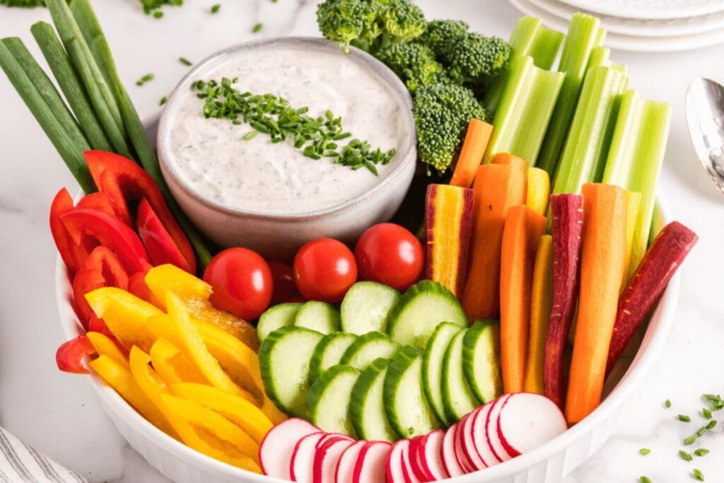A close up shot of veggie dip.