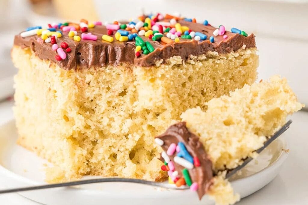 A close up shot of yellow sheet cake.