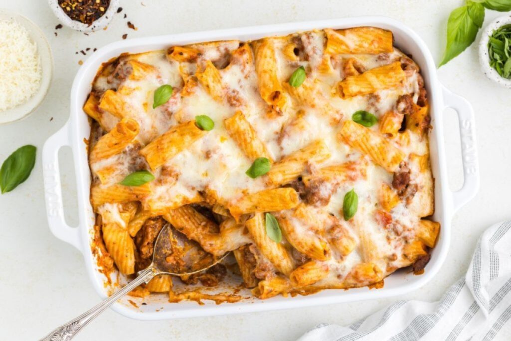 Baked rigatoni with ground beef in a baking dish.