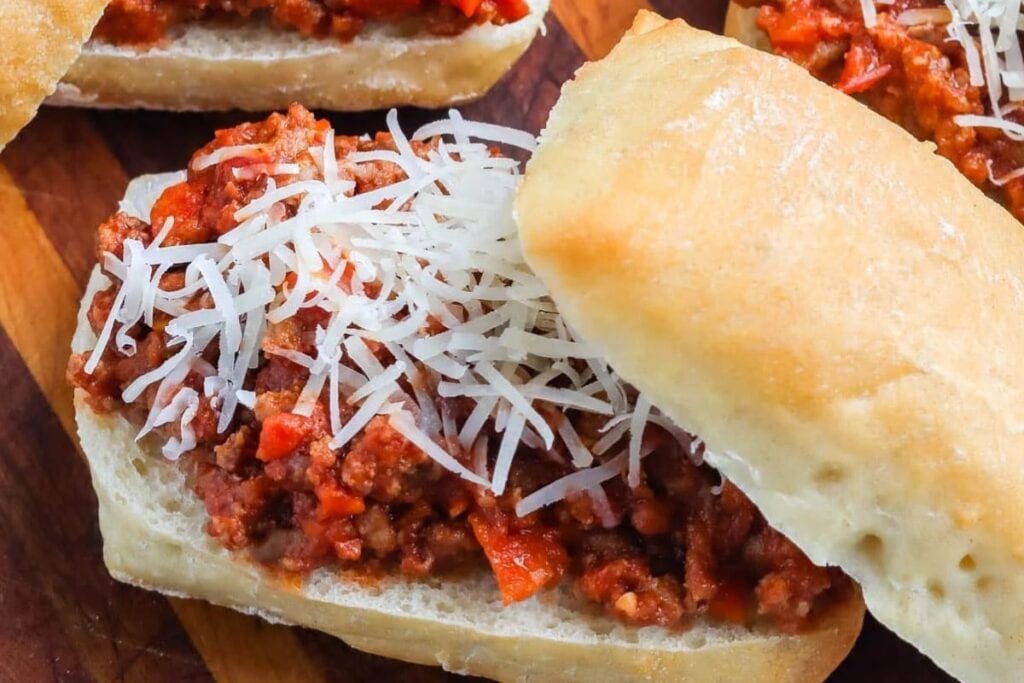 Beef Bolognese sloppy joes on a plate.