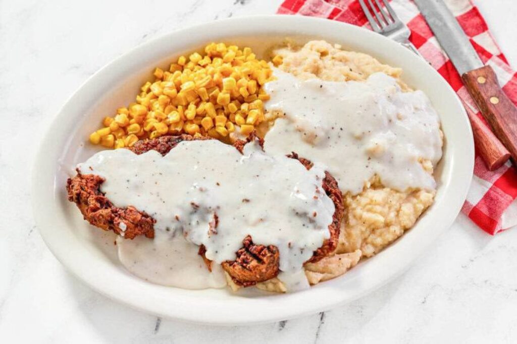 Chicken fried steak on a plate.