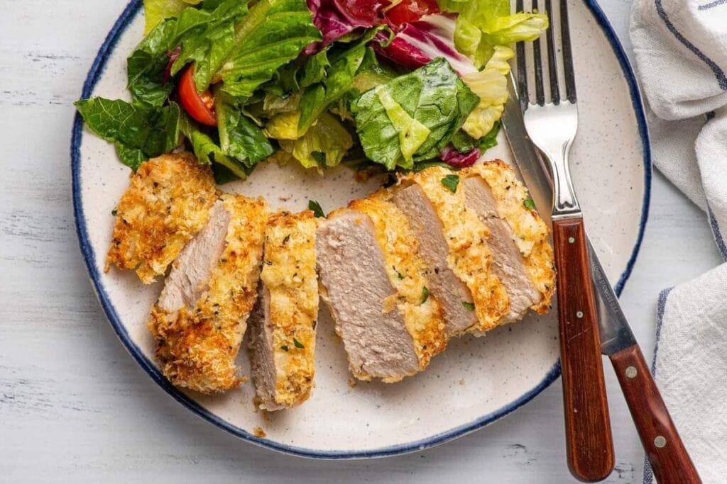Crispy air fryer pork chops on a plate.