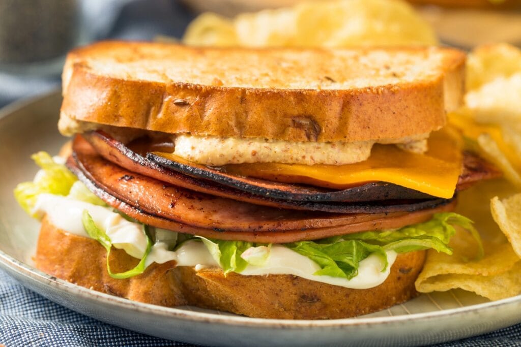 Fried bologna sandwiches on a plate.