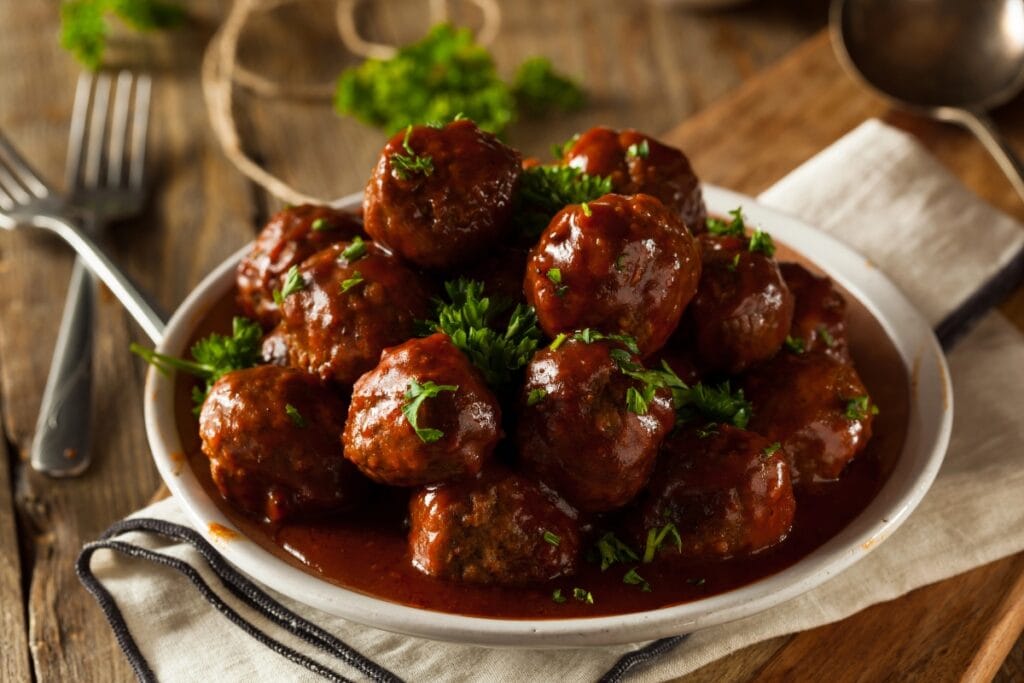 Grape jelly meatballs in a bowl.