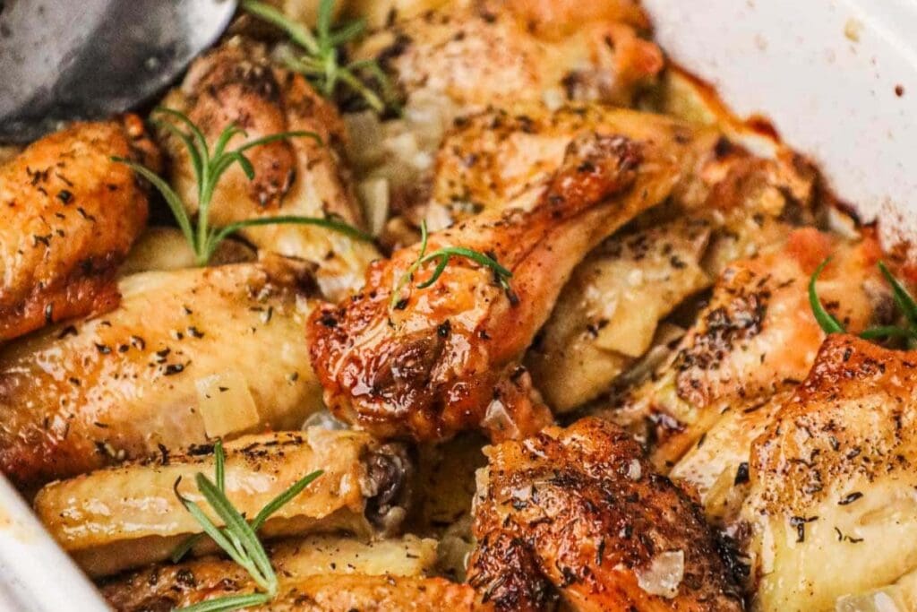 Italian rosemary chicken wings in a baking dish.
