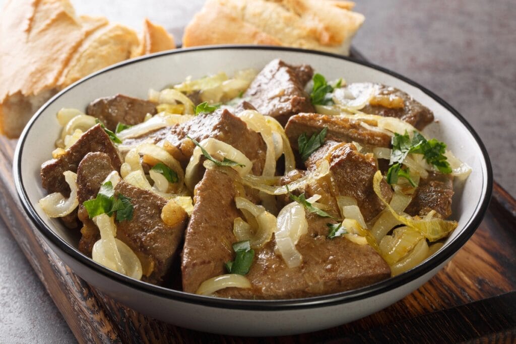 Liver and onions on a plate.