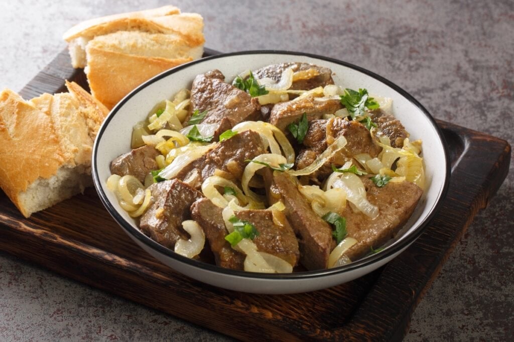 Liver and onions on a plate.