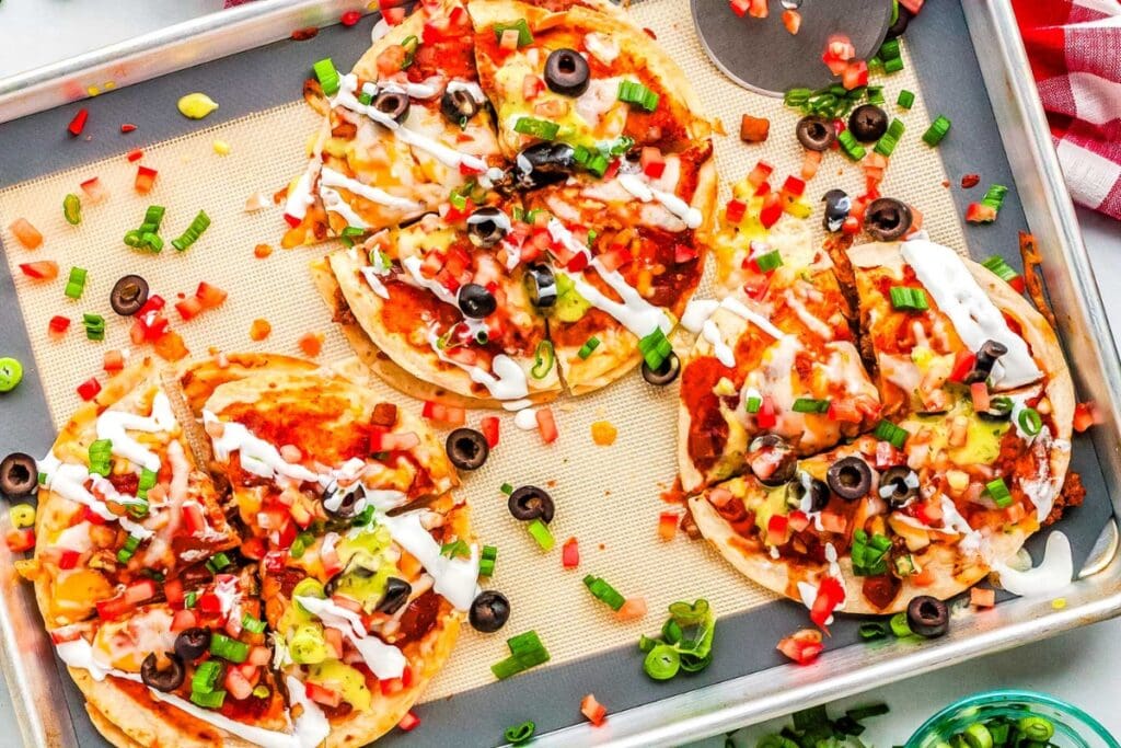 Mexican pizza on a baking sheet.