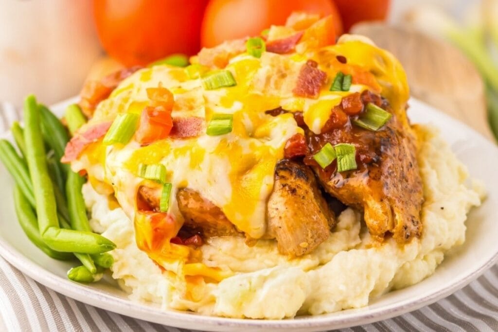 Monterey chicken on a plate.