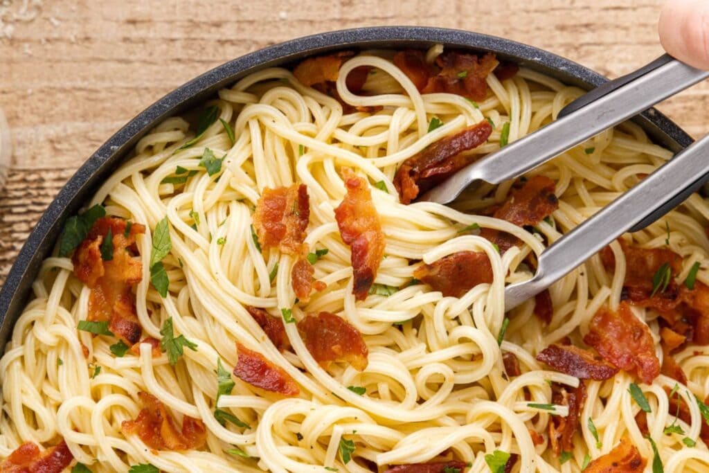 Pasta carbonara in a skillet.
