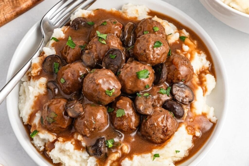 Salisbury steak meatballs served on a plate.
