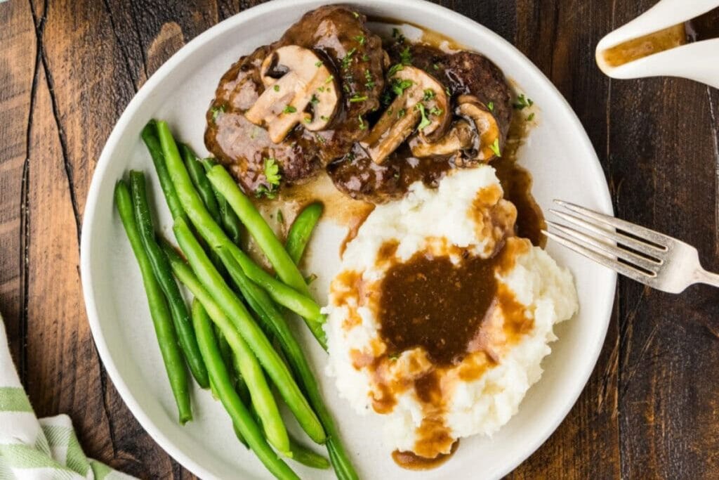 Salisbury steaks served on a plate.