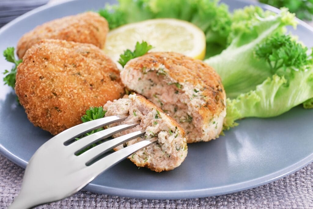 Salmon patties on a plate.