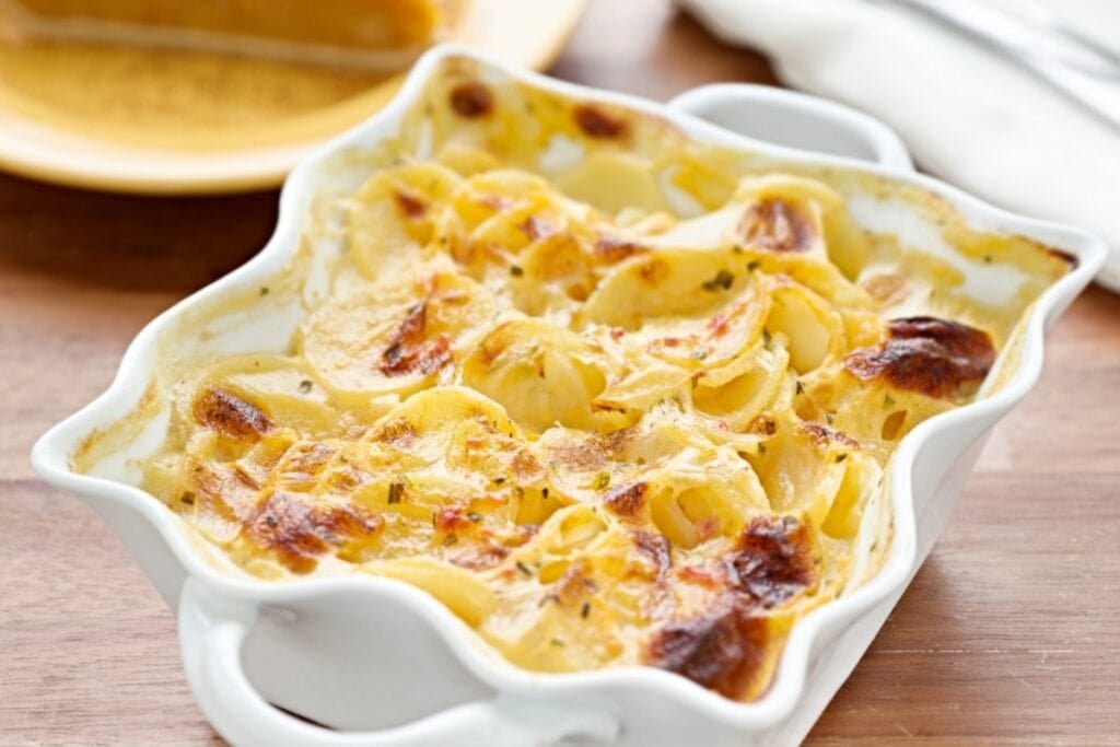 Scalloped potatoes in a baking dish.