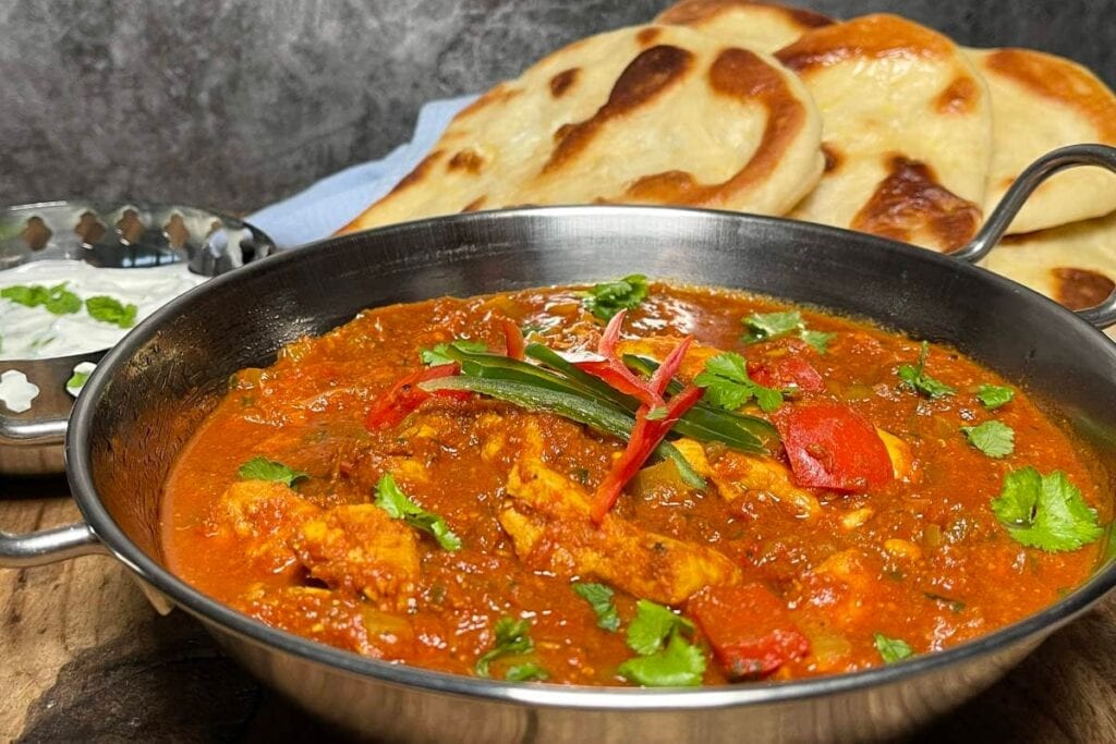 Slow cooker chicken balti curry in a pan.
