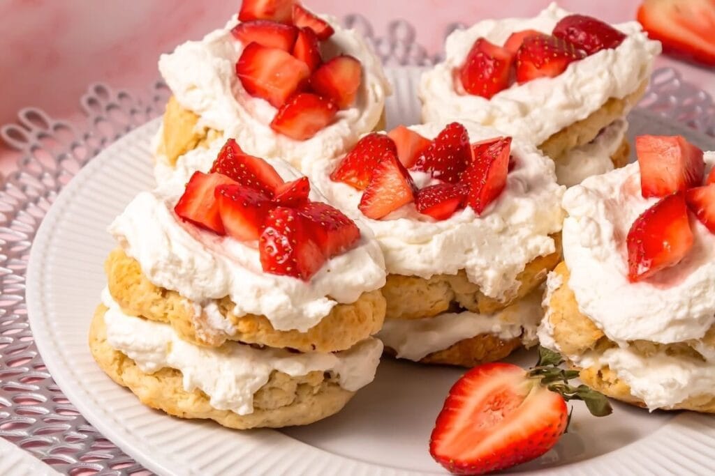 Strawberry shortcakes served on a plate.