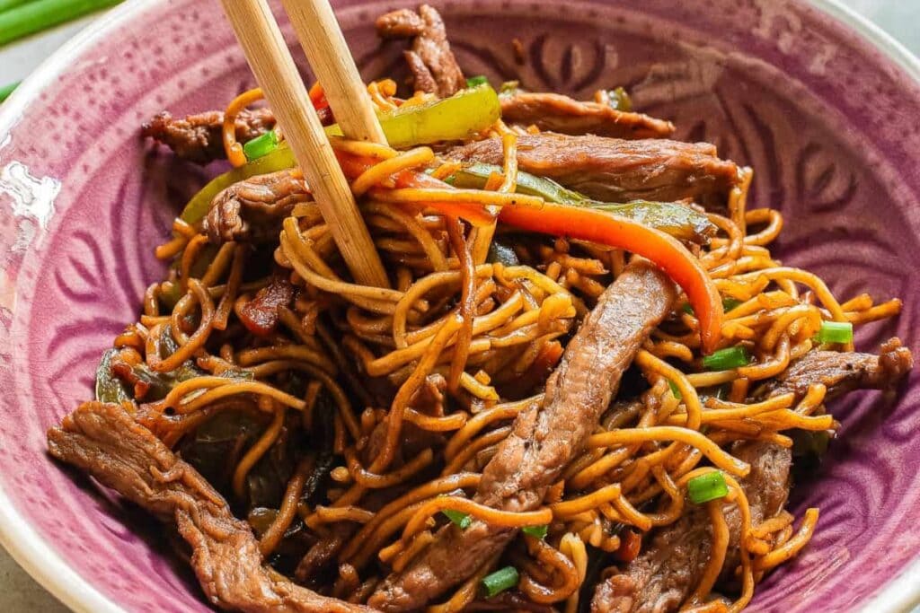 Teriyaki beef and noodles in a bowl.
