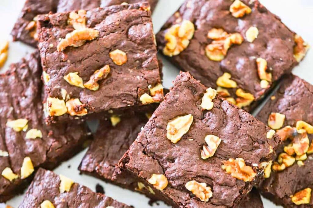 A close up shot of chocolate walnut brownies.