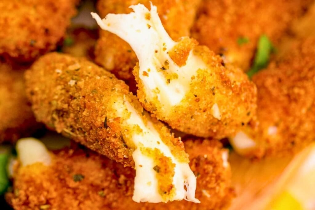 A close up shot of mozzarella sticks.