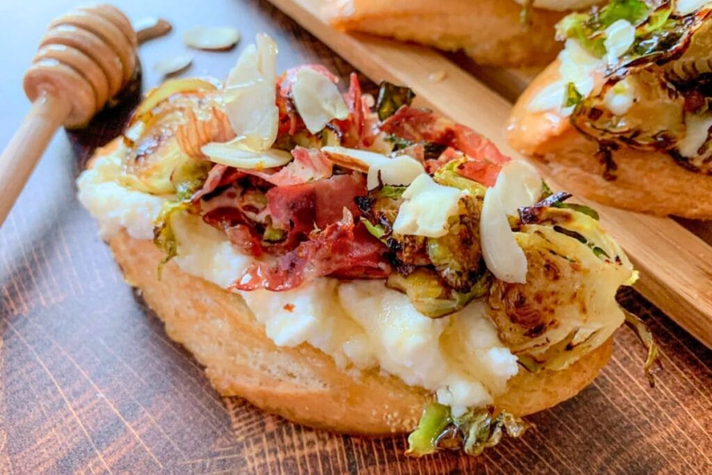 A close up shot of prosciutto crostini.