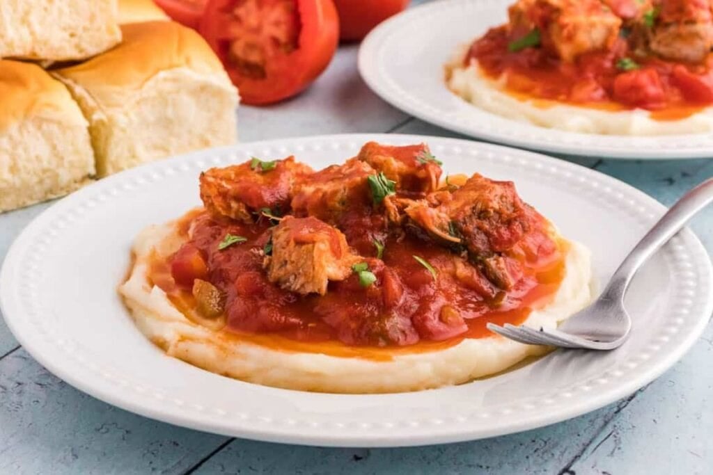 Slow Cooker Boneless Pork Ribs on a plate with sauce and a fork