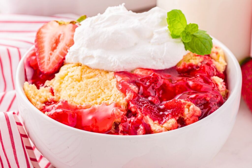 A close up shot of strawberry dump cake.