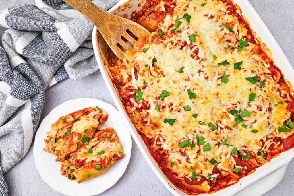 Close up shot of stuffed shells with sausage.