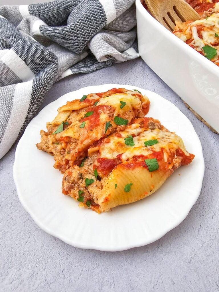 Close up shot of stuffed shells with sausage.