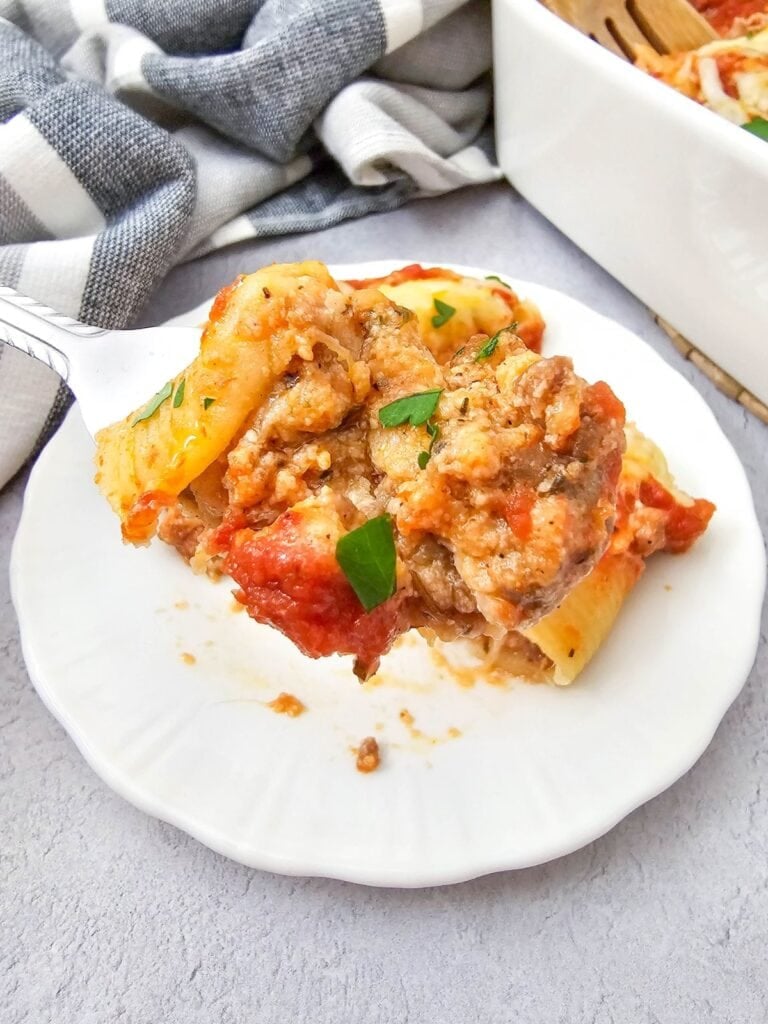 Close up shot of stuffed shells with sausage.