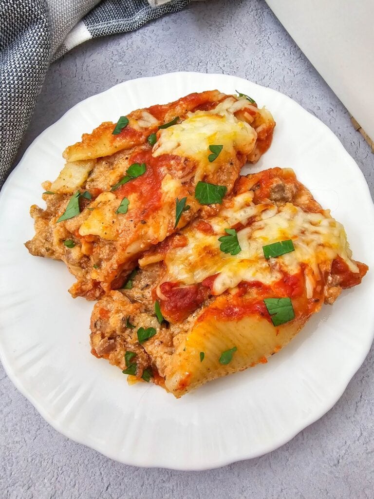 Close up shot of stuffed shells with sausage.