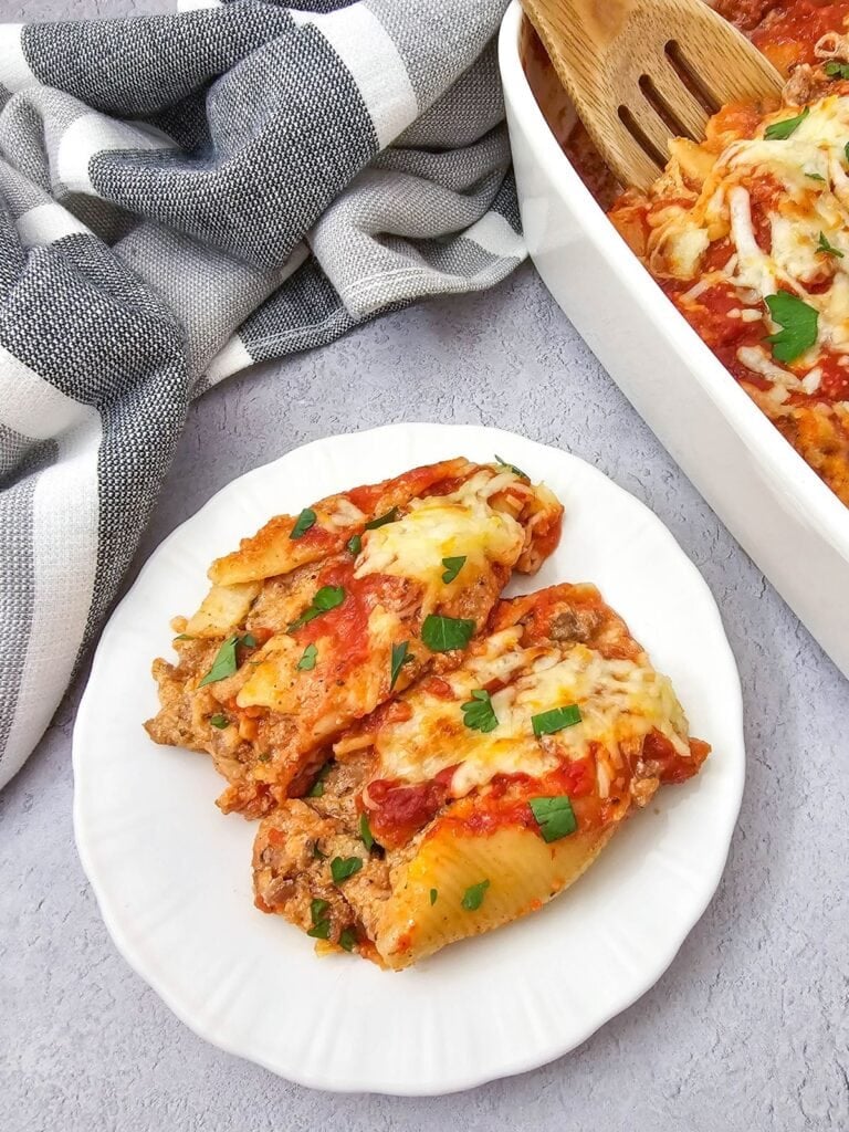 Close up shot of stuffed shells with sausage.