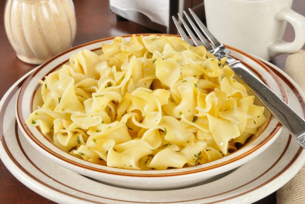 Buttered noodles on a plate.