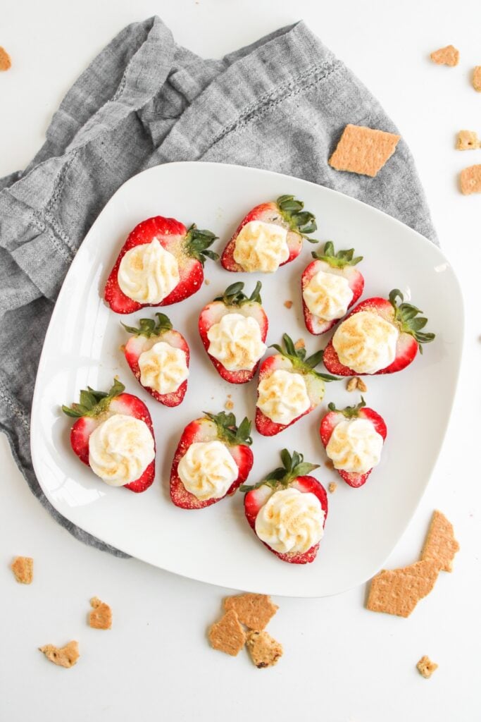 Cheesecake deviled strawberries on a plate.