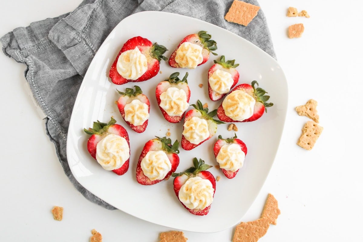 Cheesecake deviled strawberries on a plate.