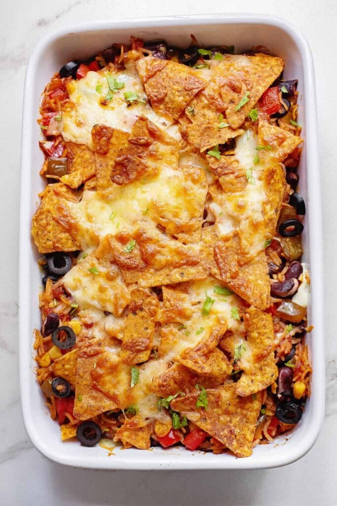 Cheesy Dorito veggie casserole in a baking dish.