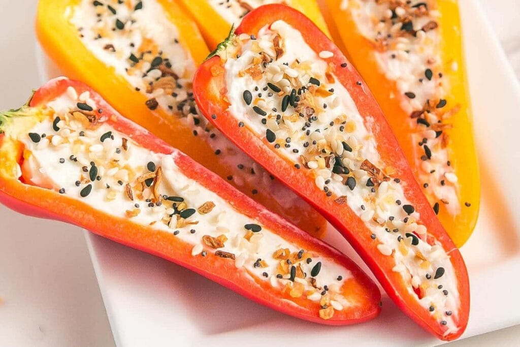 Cheesy stuffed mini peppers on a plate.