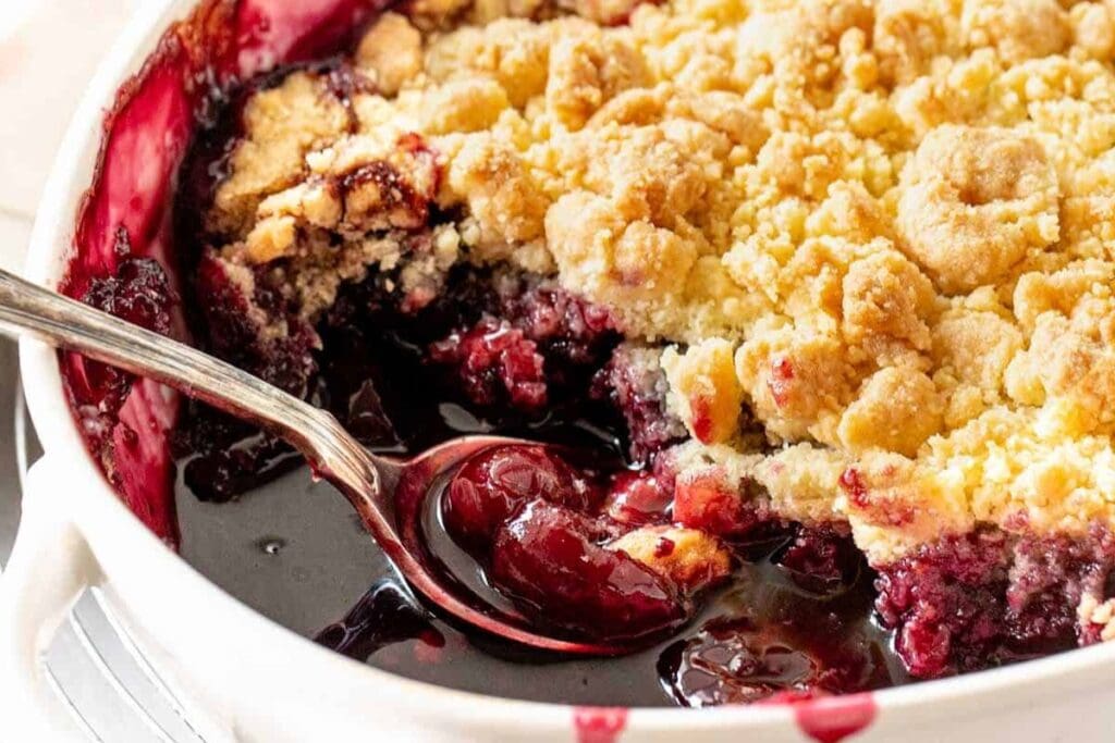 Cherry dump cake in a baking dish.