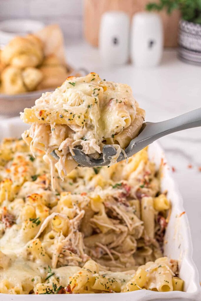 Chicken alfredo casserole on a spoon.