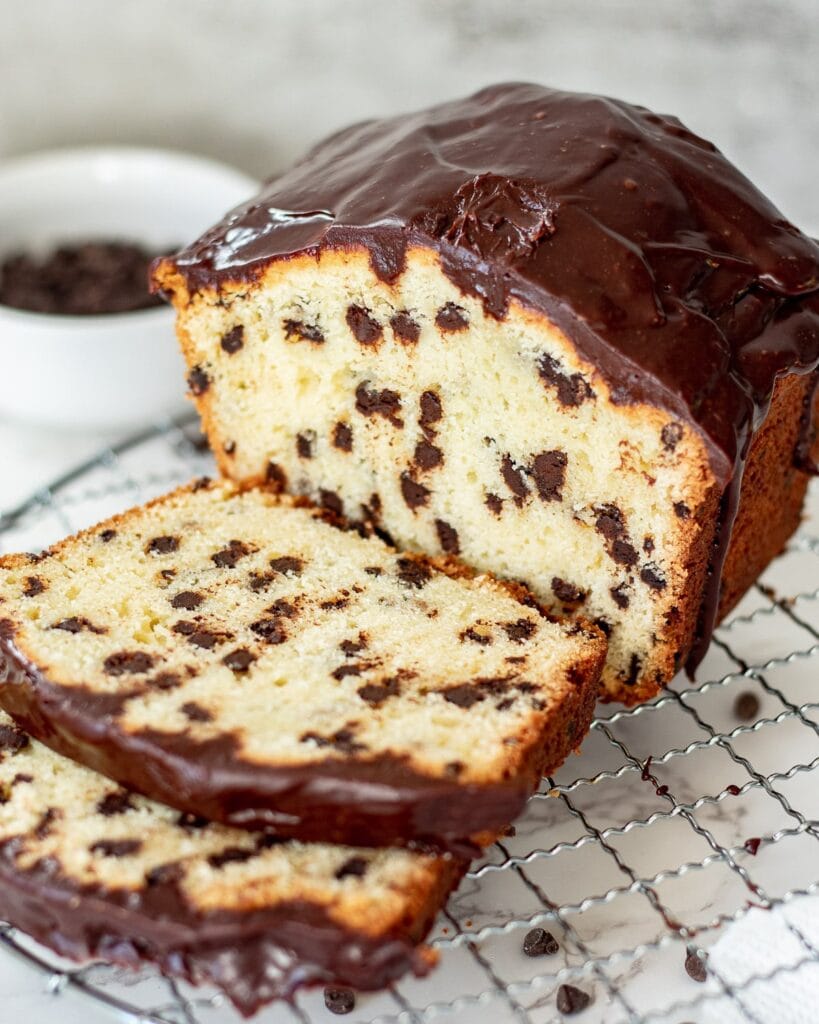 Chocolate chip loaf cake on a cooling rack.