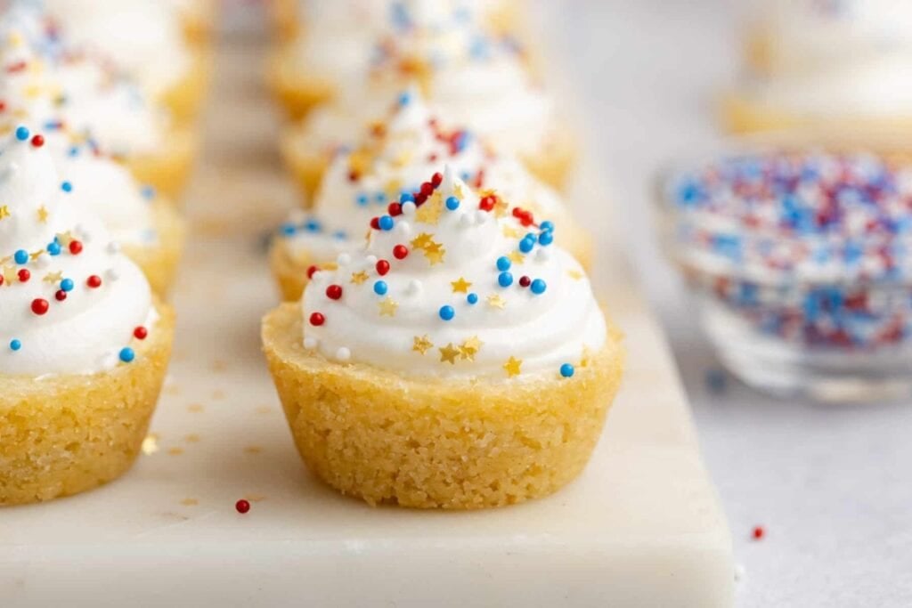 Cookie cups on a marble round plate.
