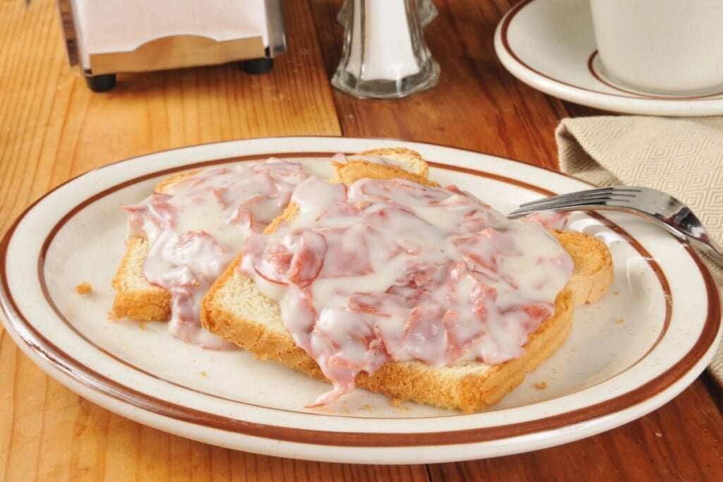 Creamed chipped beef on toast on a plate.