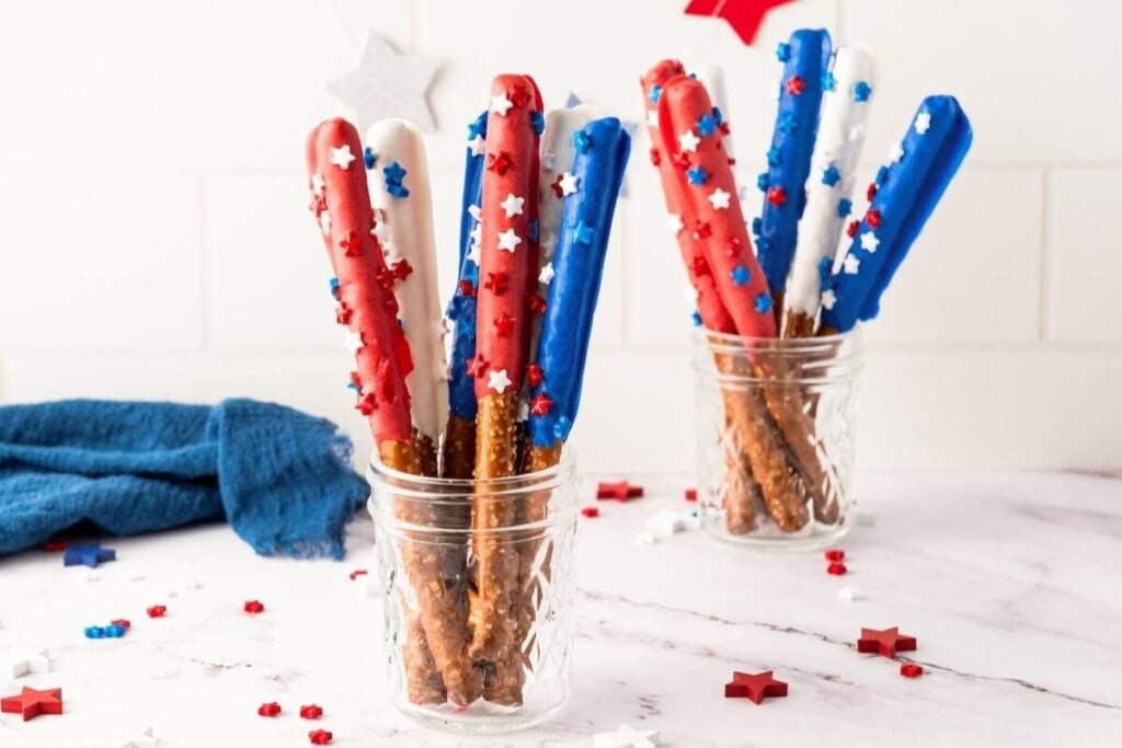 Firecracker pretzel rods in plastic cups.