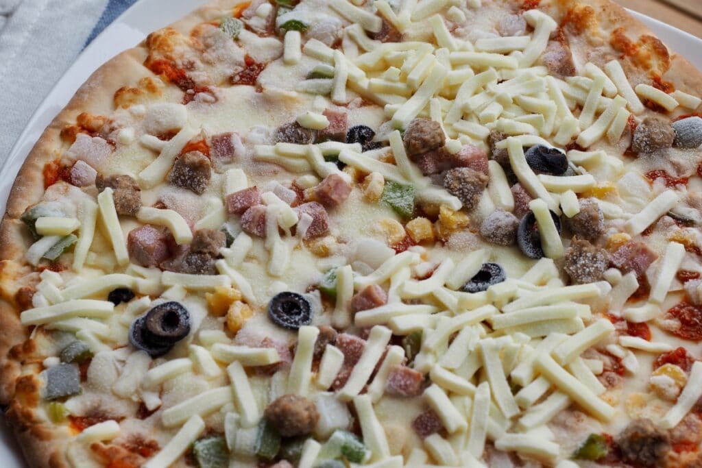 Frozen pizza with toppings.