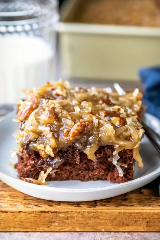 Slice of German chocolate sheet cake on a plate.