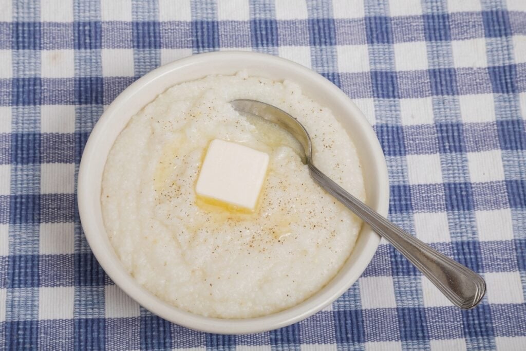Grits with butter in a bowl.